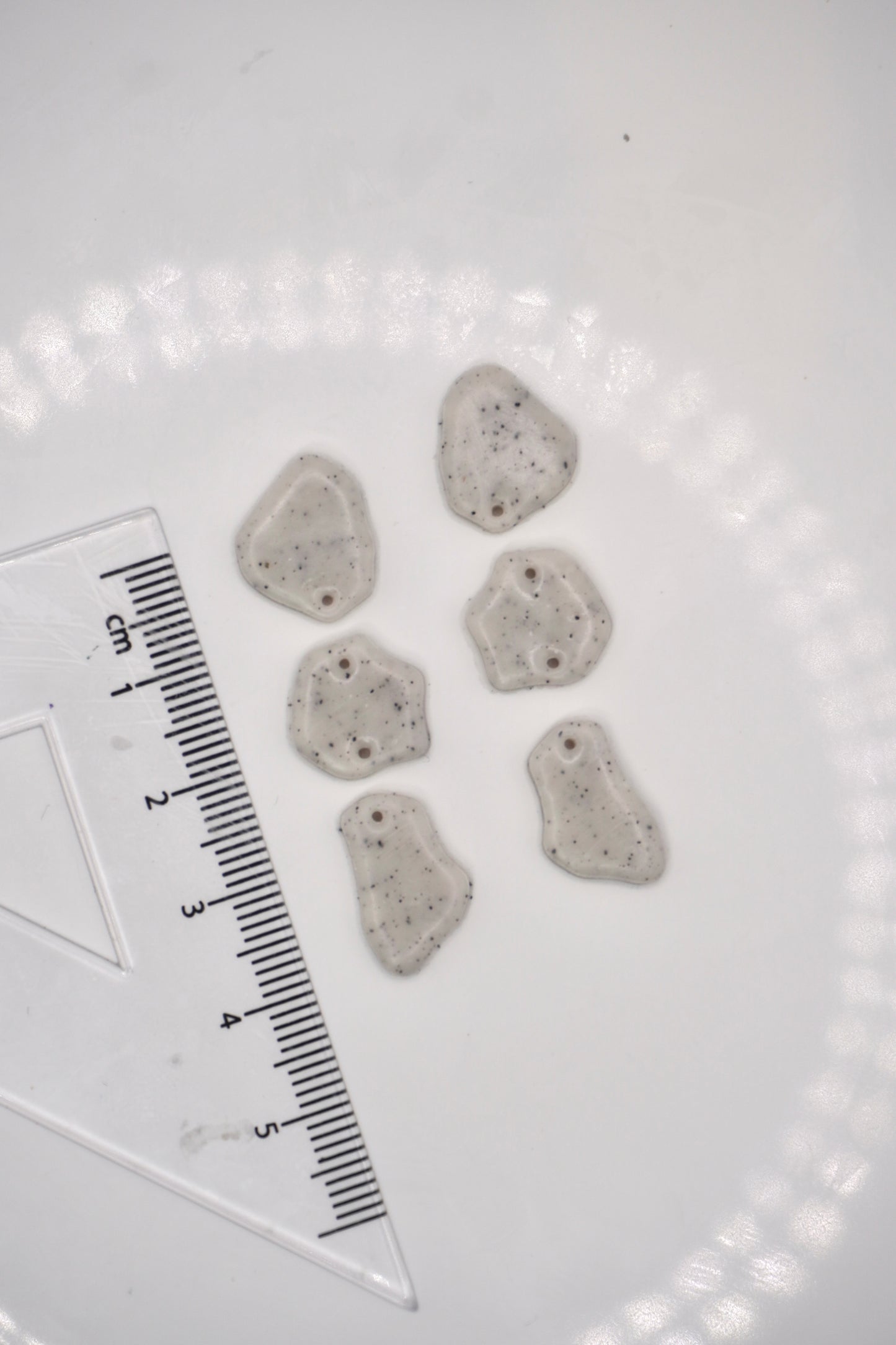 Tiny organic dangle with drill holes