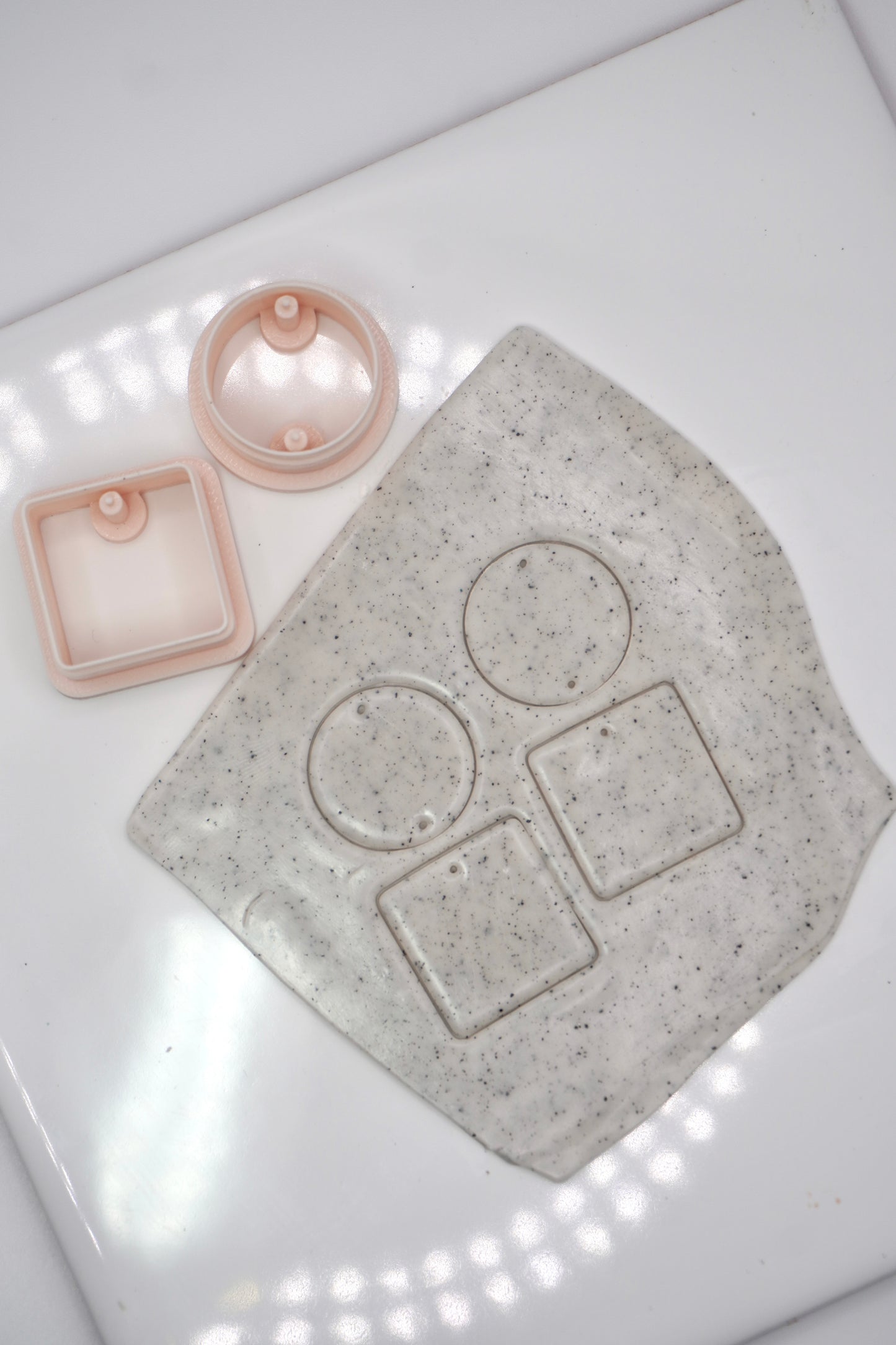 Circle and square with drill holes